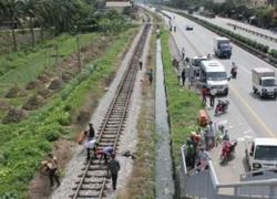 Nam thanh niên bị tàu hỏa kéo lê gần 100m