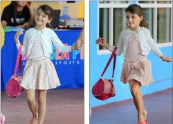 Suri Cruise tươi cười nhún nhảy bên mẹ