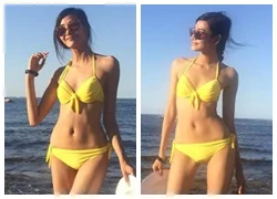 Hoàng Thùy mặc bikini khoe dáng chuẩn trên biển