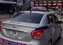 Taxi VIC dỡ bỏ quảng cáo phạm luật