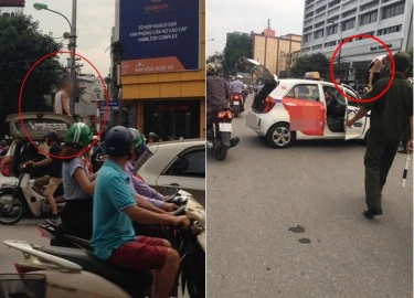 Hà Nội: Bị CSGT dừng xe, tài xế taxi leo lên nóc xe "ăn vạ"