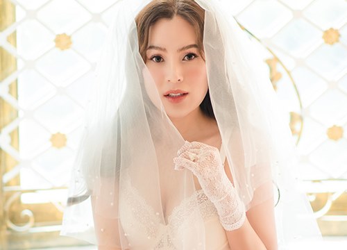 Hoa hậu Phương Lê diện áo cưới sexy dù đã sinh ba con