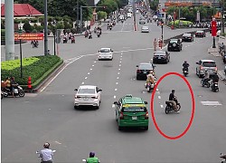 Thanh niên đầu trần, chạy xe máy ngang nhiên cắt đoàn xe ưu tiên ở TP. Hồ Chí Minh