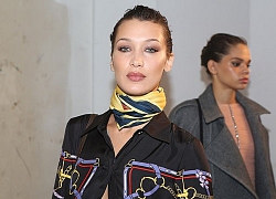 Bella Hadid buông nút áo hờ hững, khoe vòng eo săn chắc ra phố