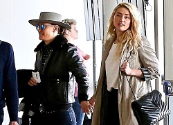 Amber Heard thể hiện tình cảm với bạn gái ở sân bay