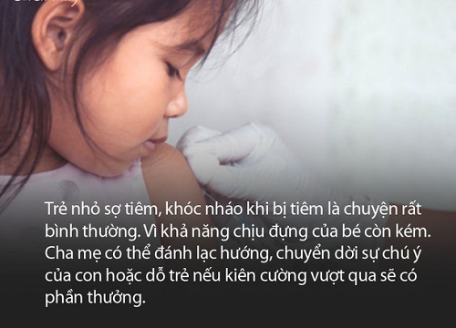 Bé trai đang khóc vật vã vì sắp bị tiêm, thấy cô y tá xinh đẹp thì "đứng hình" trong mấy giây liền