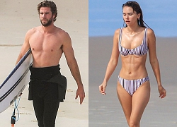 Liam Hemsworth và bạn gái khoe hình thể trên biển