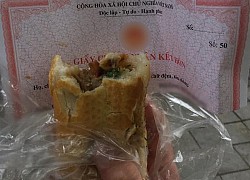 Ăn nửa cái bánh mì, anh chàng giật mình khi nhìn thấy dòng chữ trên giấy gói: Bảo sao khó nuốt thế!
