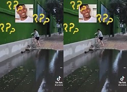 Chàng trai xử lý cồng kềnh khi qua vũng nước