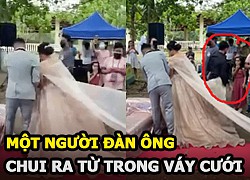 Một người đàn ông bỗng chui ra từ váy cô dâu khiến khách mời xanh mặt trong đám cưới