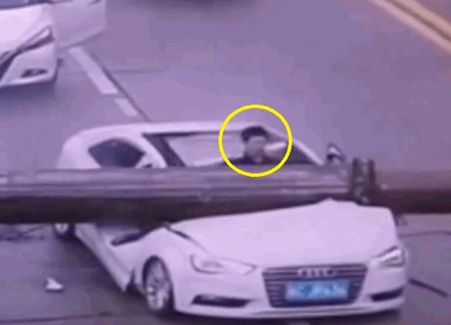 Clip: Cần trục rơi xuống đường đè nát Audi, tài xế thoát chết khó tin