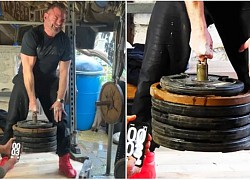 Kinh ngạc người đàn ông dùng 1 ngón tay nâng khối đĩa sắt 129 kg