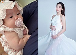 Sau 2 tháng sinh con, Hoa hậu Đỗ Mỹ Linh lần đầu công khai cận gương mặt ái nữ