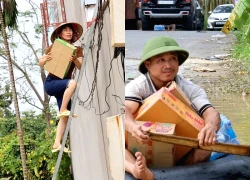 Video: Lũ rút chậm, người dân chèo thuyền tự chế, trèo thang nhận đồ tiếp tế