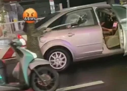 Xác minh clip người phụ nữ đi xe máy đuổi theo đập vỡ kính ô tô