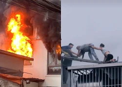 Cháy dữ dội nhà 7 tầng ở Hà Nội, hai người đàn ông đục mái tôn giải cứu nạn nhân