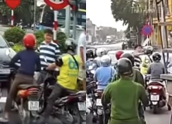 Ô tô dừng ngược chiều, người đàn ông ở Hà Nội hành hung tài xế xe máy