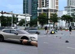Xe máy biến dạng sau cú va chạm với ô tô Porsche trên đường ở Hà Nội