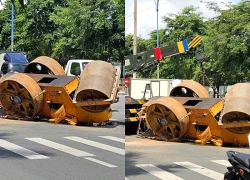 Xe lu hàng tấn rơi lật ngửa, người đàn ông bỏ xe máy, ôm bé trai 12 tuổi tháo chạy