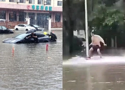 Người Trung Quốc bơi lội, lướt ván trên đường phố ngập lũ