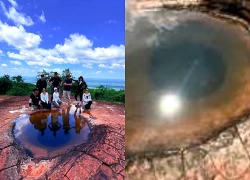 "Mắt rồng" lộ diện khi nước mưa lấp đầy hõm đá thu hút khách chiêm ngưỡng
