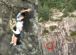 Mắc kẹt trên vách đá cao 80m không dây bảo hộ, người đàn ông có hành động gây tranh cãi